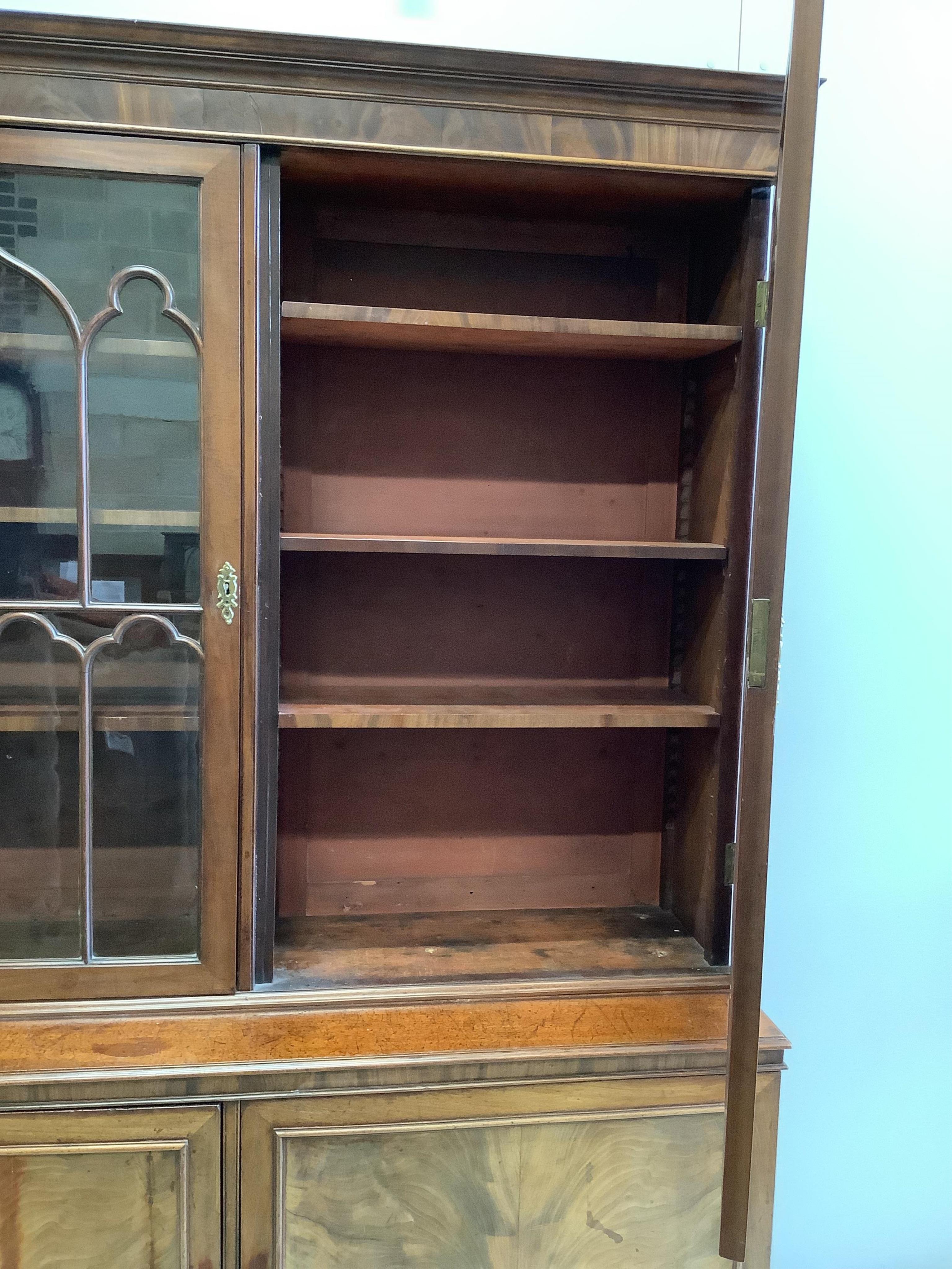 A George III mahogany bookcase, width 152cm, depth 47cm, height 203cm. Condition - fair to good